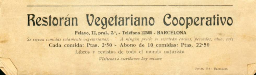 Un anunci d'un restaurant vegetarià al carrer del Call.