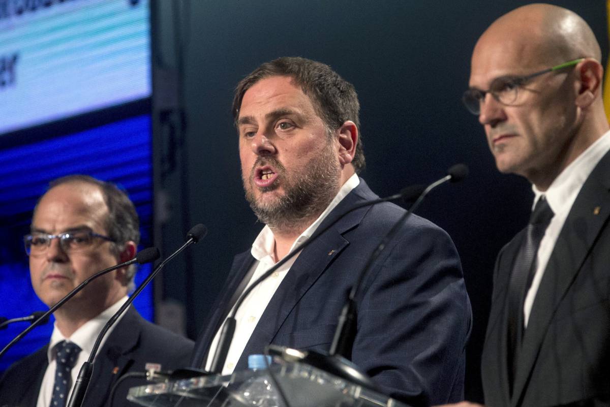 Turull, Junqueras y Romeva, en la rueda de prensa de ayer.
