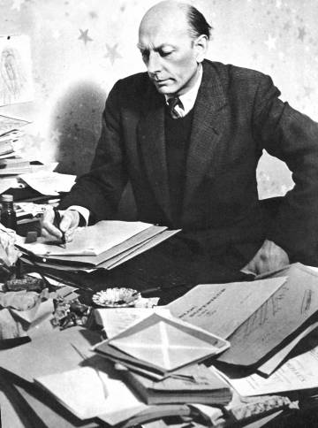 Henri Michaux, at his chaotic desk.