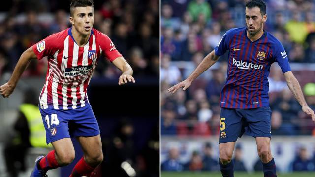 Rodri y Busquets en un partido del Atlético y el Barça.