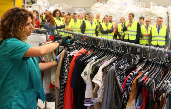 An employee of the new recycling plant in Mungia, in the Basque Country, sorts through clothes for recycling. An employee of the new recycling plant in Mungia, in the Basque Country, sorts through clothes for recycling.