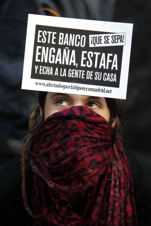 A protestor outside Bankia headquarters. A protestor outside Bankia headquarters.