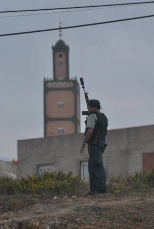 An officer stands guard near the La Caracola mosque. An officer stands guard near the La Caracola mosque.