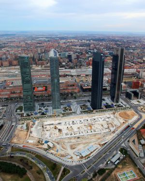 The Cuatro Torres Business Centre, with the foundations of the International Convention Centre visible in the foreground. The Cuatro Torres Business Centre, with the foundations of the International Convention Centre visible in the foreground.
