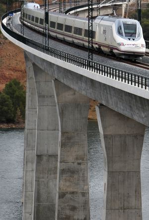 The Madrid-Valencia high-speed train passing through one of the viaducts. The Madrid-Valencia high-speed train passing through one of the viaducts.