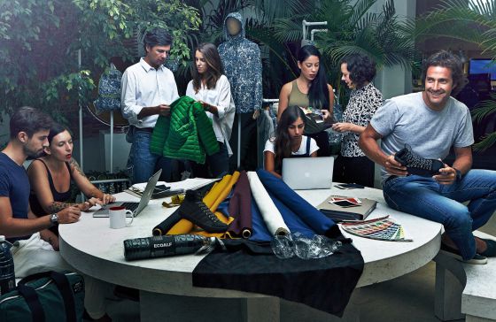 Javier Goyeneche surrounded by part of his team, which includes a chemical engineer.