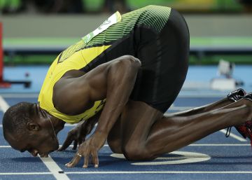 Usain Bolt from Jamaica kisses the track, after crossing the line to win the gold medal in the men's 200-meter final, during the athletics competitions of the 2016 Summer Olympics at the Olympic stadium in Rio de Janeiro, Brazil, Thursday, Aug. 18, 2016. (AP PhotoMatt Dunham)