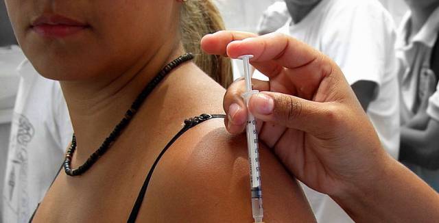 A vaccination being administered. A vaccination being administered.
