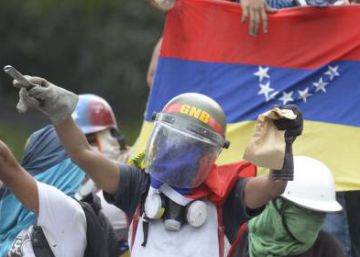 Two dead in Venezuela as protests spread to government stronghold Two dead in Venezuela as protests spread to government stronghold