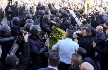 Police clash with protestors in Madrid today.