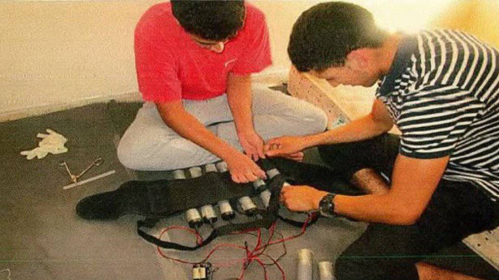 Youssef Aalla and Younes Abouyaaqoub fitting a vest with explosives.