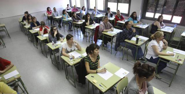 Students sit a teachers’ exam.