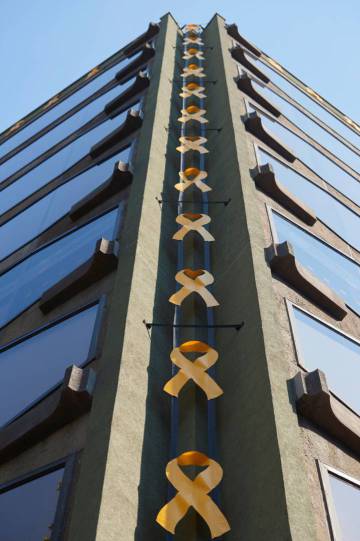 Yellow ribbons adorn a building in Barcelona.