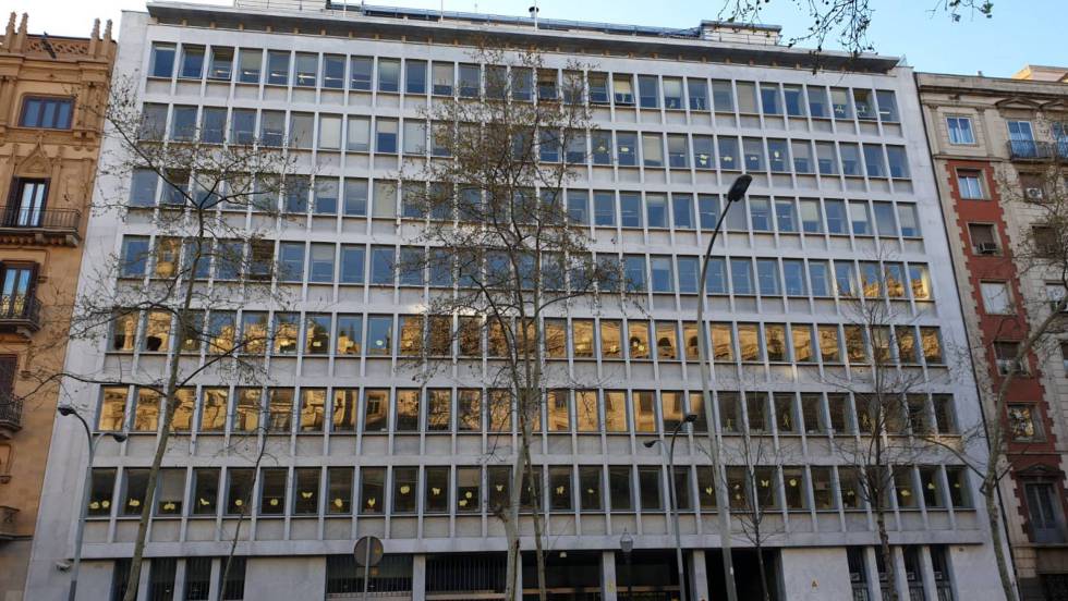 The Catalan agriculture department with yellow cut-out figures on the windows.