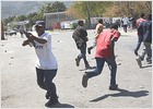 Los rebeldes haitianos aceptan deponer las armas tras la renuncia de Aristide