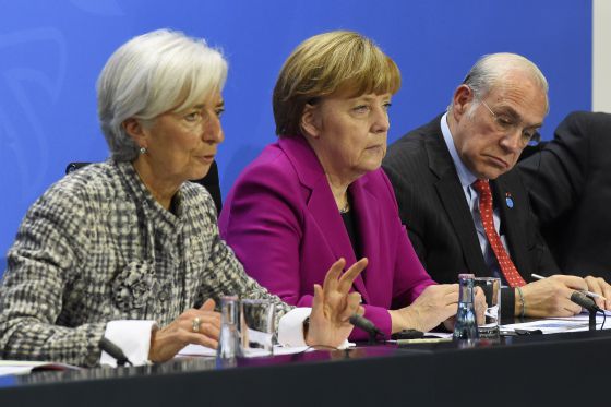Christine Lagarde asistió este miércoles a una reunión en Berlín junto a la canciller Angela Merkel y el secretario de la OCDE, Angel Gurría.