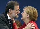 Merkel and Sarkozy give election backing to Spanish PM in Madrid