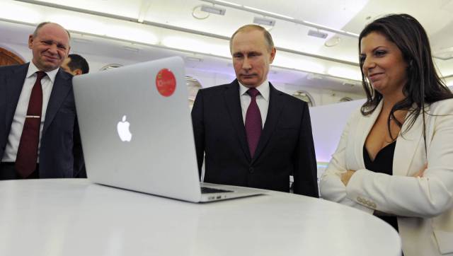 Simonián y Putin, en 2015.