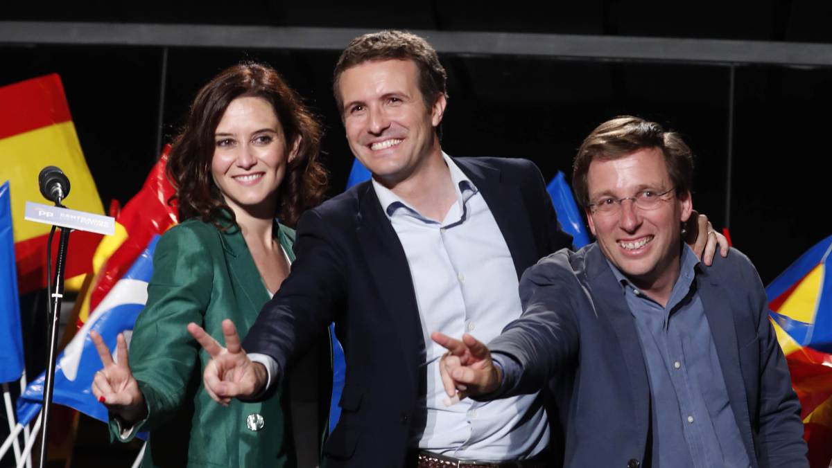 Isabel Díaz Ayuso, Pablo Casado y José Luis Martínez-Almeida, este domingo.