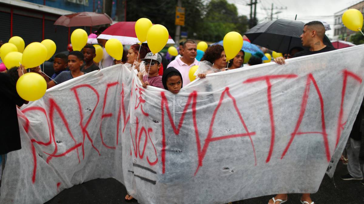 Residents march in memoriam of the 8-year-old Agatha Sales Felix, who was killed by a stray bullet, at the Alemao complex slum during a police operation in Rio de Janeiro, Brazil September 22, 2019. The banner reads,