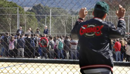 A student watches the tribute to the late German exchange students.