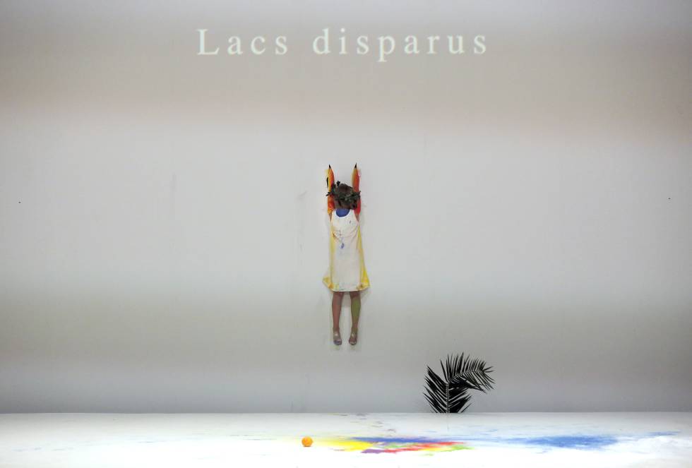 A girl who embodies one of the Four Ages hangs on the wall under the label of the missing lakes.