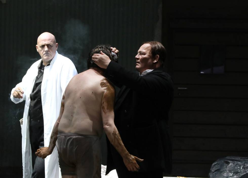 Georg Nigl (Lenz), on his back, attended by John Daszak (Kaufmann) and Wolfgang Bankl (Oberlin) in the last scene of 'Jakob Lenz'.