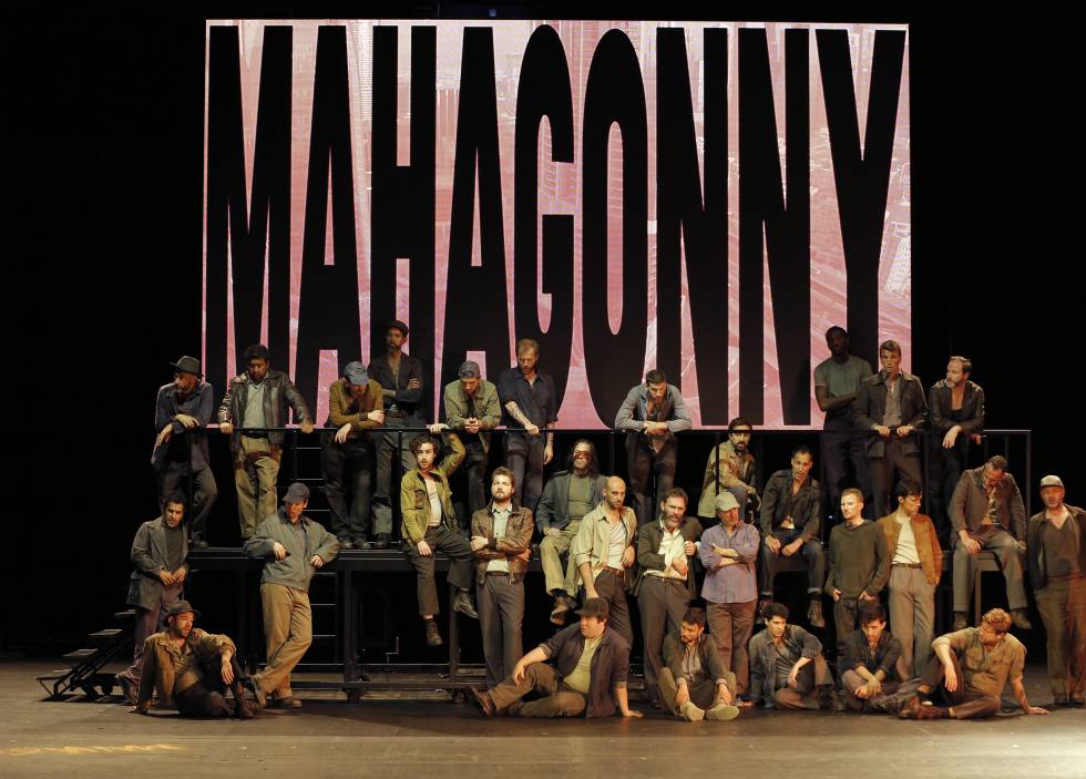 A group of men recently arrived at Mahagonny in the first act of the opera.