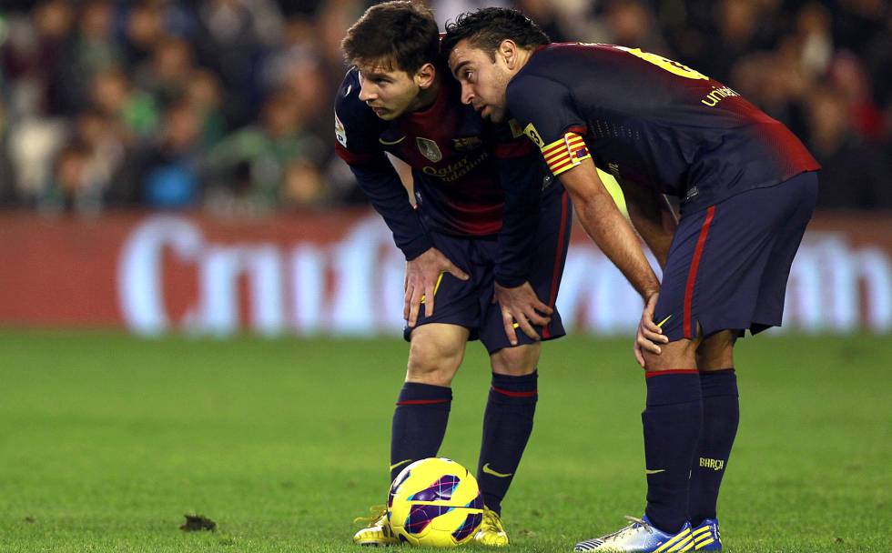 Xavi y Messi, en un Betis-Barça, en 2012.