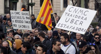 Taxi drivers and their families protest in Madrid on Thursday.