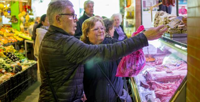 A couple shops in a market in Seville.