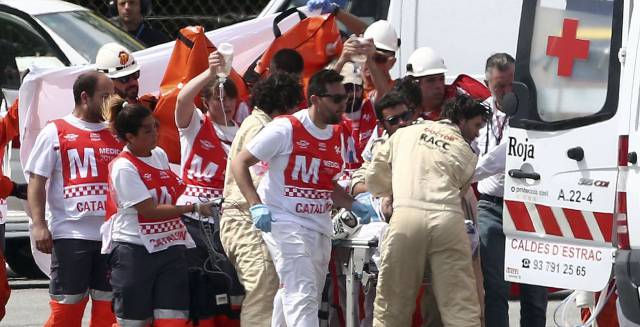 Luis Salom is treated by ambulance crews