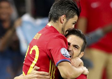 Spain's Nolito, left, celebrates with his teammate Cesc Fabregas after scoring his side's second goal during the Euro 2016 Group D soccer match between Spain and Turkey at the Allianz Riviera stadium in Nice, France, Friday, June 17, 2016. (AP PhotoClaude Paris)