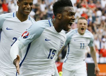 England's Daniel Sturridge, front, celebrates after scoring his sidex92s second goal during the Euro 2016 Group B soccer match between England and Wales at the Bollaert stadium in Lens, France, Thursday, June 16, 2016. Behind are Marcus Rashford, left, and Jamie Vardy. (AP PhotoKirsty Wigglesworth)