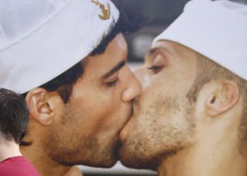 A couple takes a selfie in front of one of the photos in Seville. 