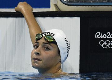 Refugee Olympic Team's Yusra Mardini takes part in the Women's 100m Butterfly heat during the swimming event at the Rio 2016 Olympic Games at the Olympic Aquatics Stadium in Rio de Janeiro on August 6, 2016.  AFP PHOTO  Martin BUREAU