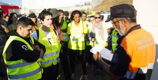 Volunteers receive instructions before setting out on the search.