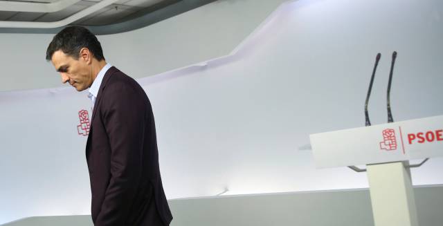 Pedro Sanchez leaves after announcing his resignation.