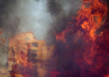 A wildfire rages in Haifa, Israel, Thursday, Nov. 24, 2016. The blaze ripped through parts of Israel's third-largest city, forcing tens of thousands of people to evacuate their homes and prompting a rare call-up of hundreds of military reservists to join overstretched police and firefighters. Spreading quickly due to dry, windy weather, the fire quickly spread through Haifa's northern neighborhoods. While there were no serious injuries, several dozen people were hospitalized for smoke inhalation. (AP PhotoAriel Schalit)
