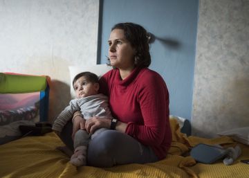 In this photo taken Wednesday, Dec. 21, 2016, Hzno Salo, 24, holds her six-months daughter Xzidxan inside the room of a hotel, in the northern Greek village of Agios Athanasios, near Thessaloniki city. Portugal has offered to take in several hundred of the 2,500 Yazidi refugees living in Greece, arguing that the mistreated religious minority merits special protection. (AP PhotoGiannis Papanikos)