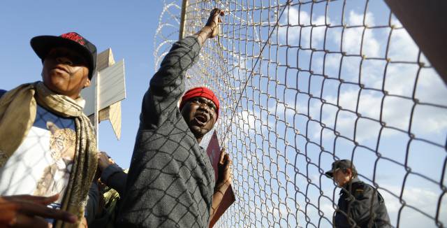 Protesters at site of the tragedy.