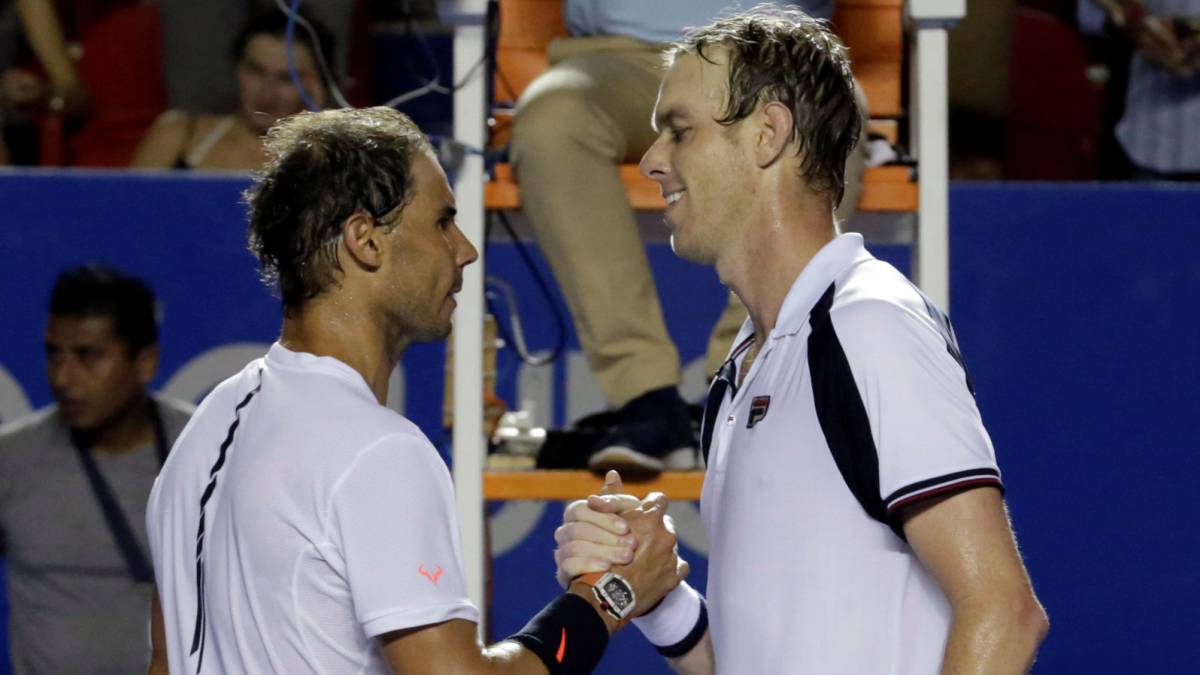 Nadal felicita a Querrey tras su victoria.