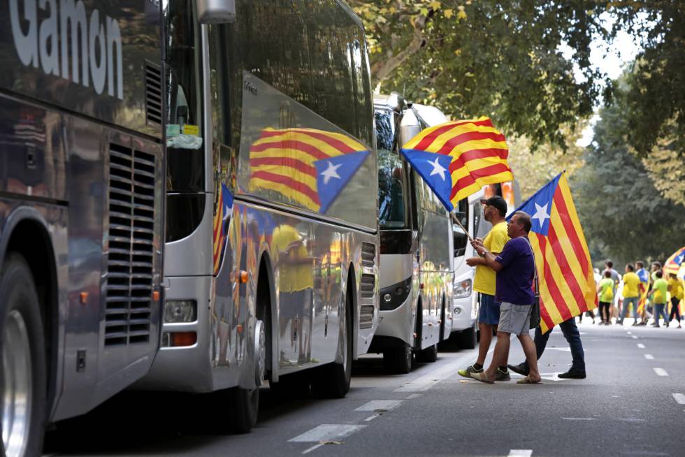 Pro-independence supporters board buses to attend La Diada, or Catalan National Day.