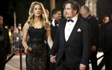 Johnny Deep y su exmujer Amber Heard en un estreno.