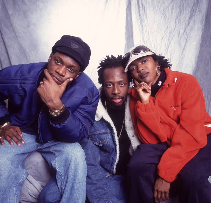 Pras, Wyclef Jean și Lauryn Hill în scena lor ca Fugees.