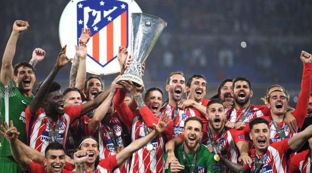 Los jugadores del Atlético celebran el título en Lyon.