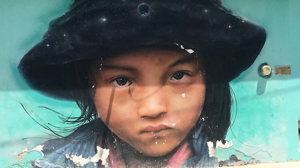 Pintada de una niÃ±a sobre un muro.