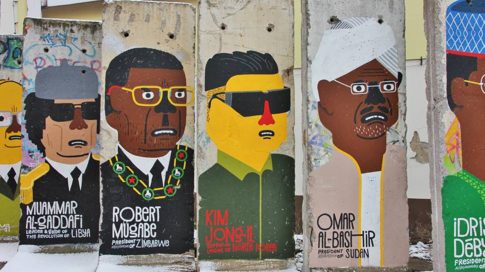 Caricaturas de líderes mundiales, sobre un muro.