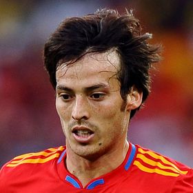 DURBAN, SOUTH AFRICA - JUNE 16:  David Silva of Spain runs with the ball during the 2010 FIFA World Cup South Africa Group H match between Spain and Switzerland at Durban Stadium on June 16, 2010 in Durban, South Africa.  (Photo by Laurence Griffiths/Getty Images)