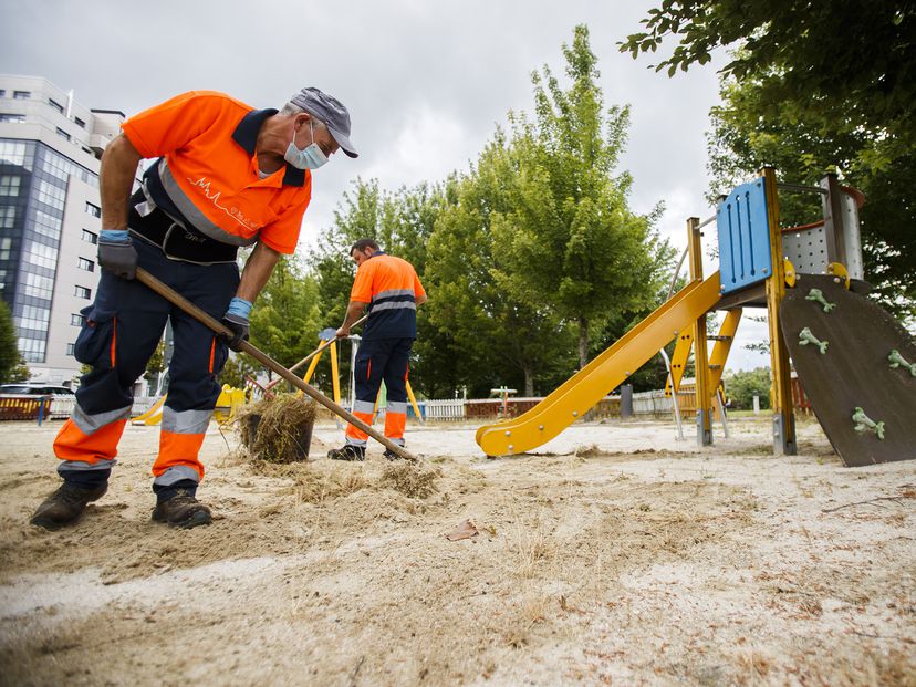 City workers cleaning up a playground in Santiago de Compostela.